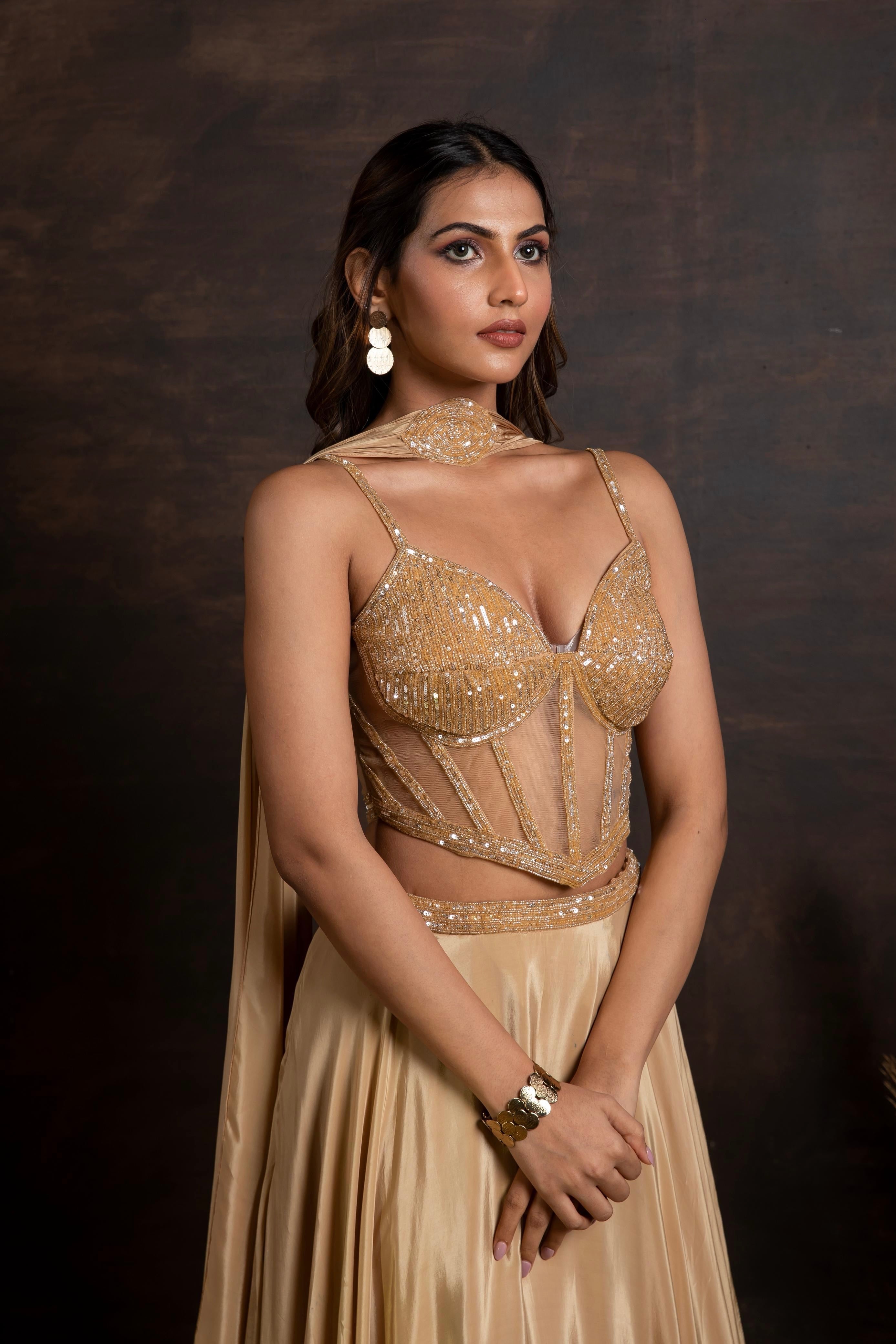 Golden handwork corset with satin crepe lehenga and choker duppatta
