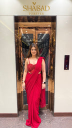 Red stone work corset blouse sequin drape saree