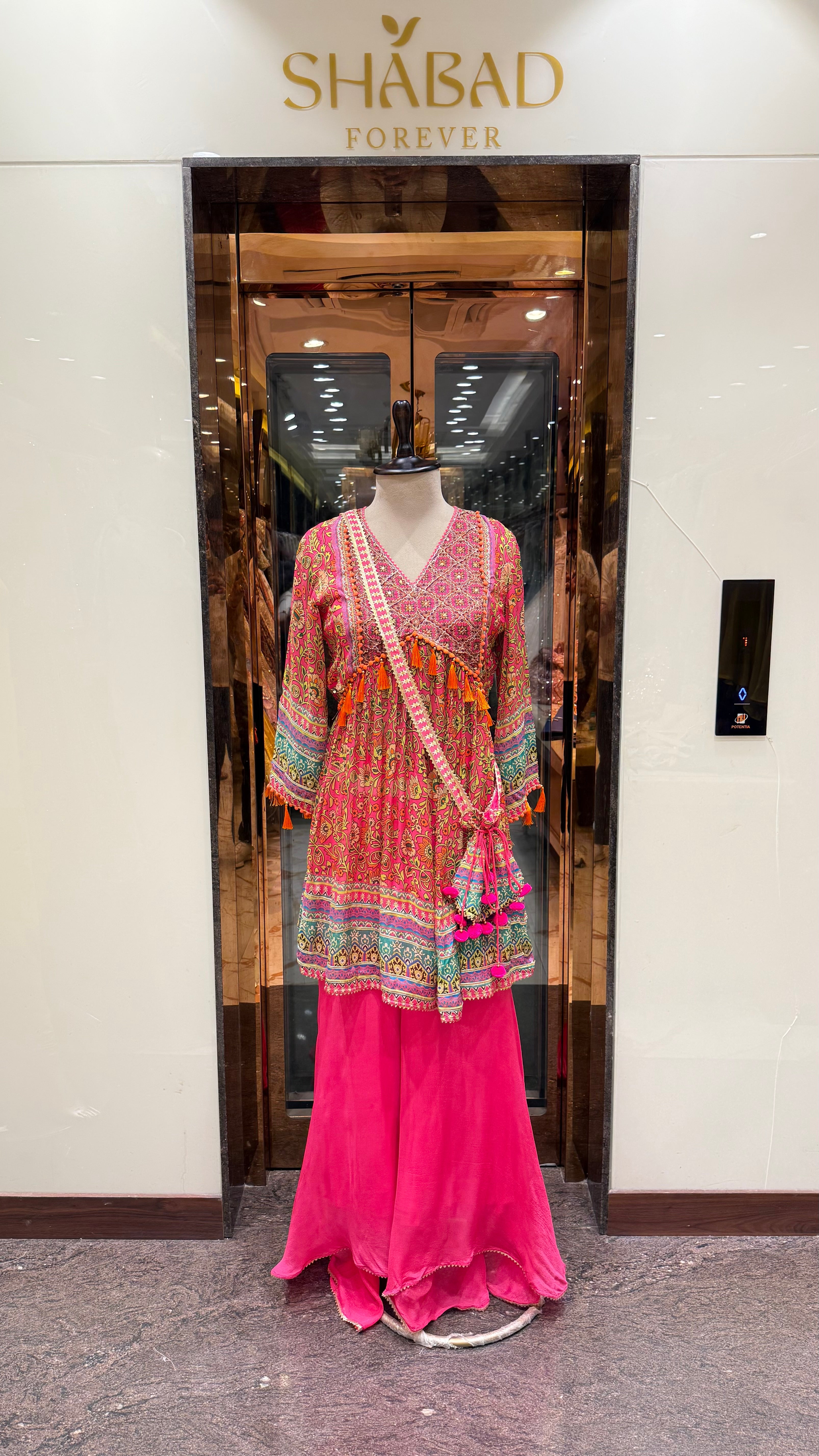 PRINTED PEPLUM KURTA WITH GHARARA & POTLI BAG