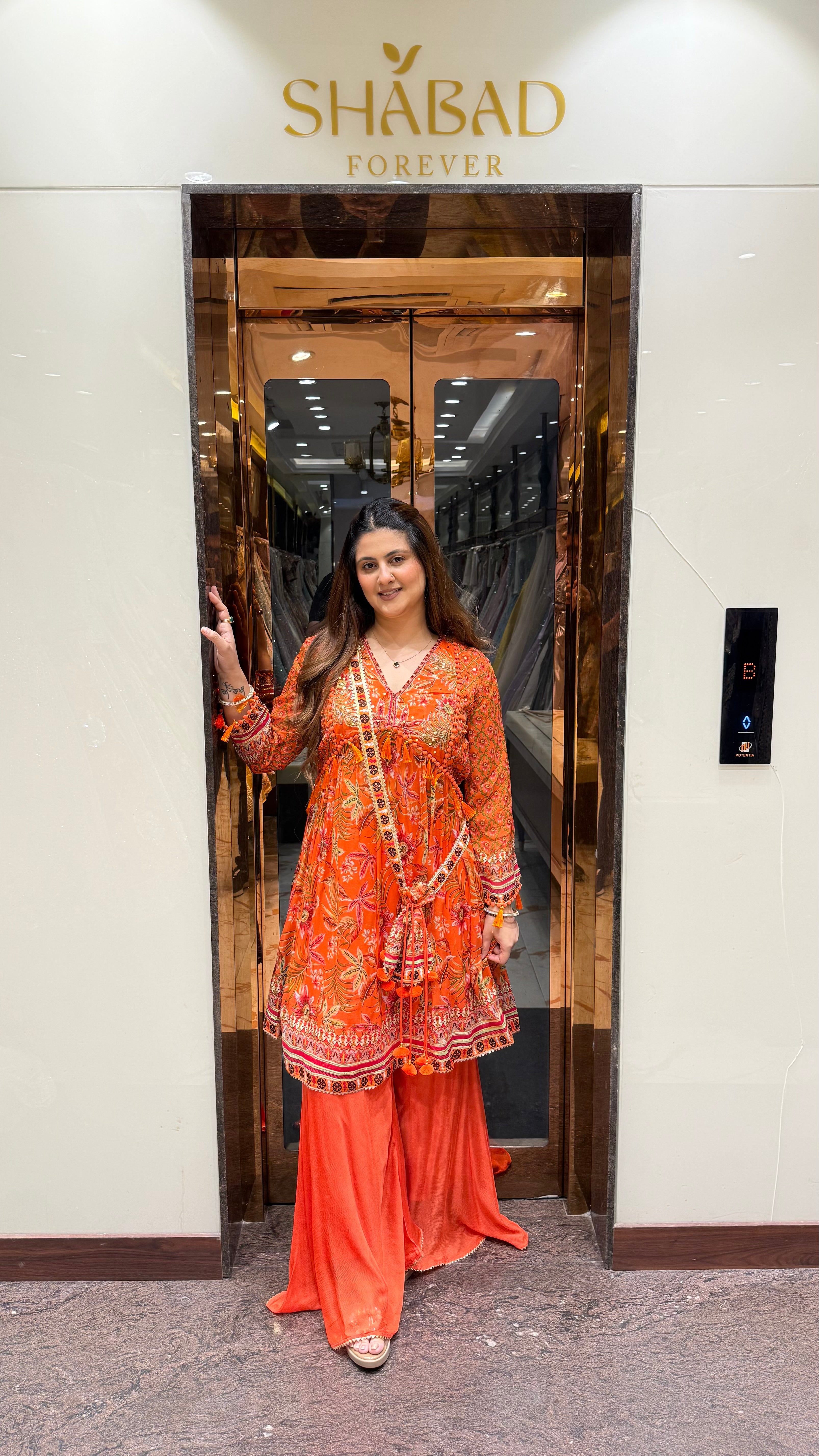 PRINTED PEPLUM KURTA WITH GHARARA & POTLI BAG