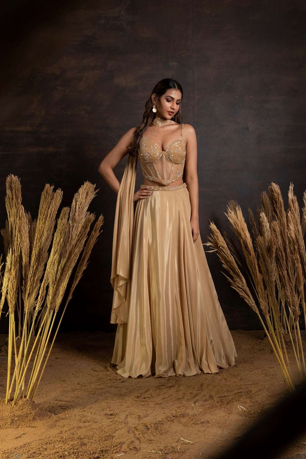 Golden handwork corset with satin crepe lehenga and choker duppatta