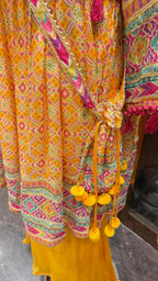 PRINTED PEPLUM KURTA WITH GHARARA & POTLI BAG