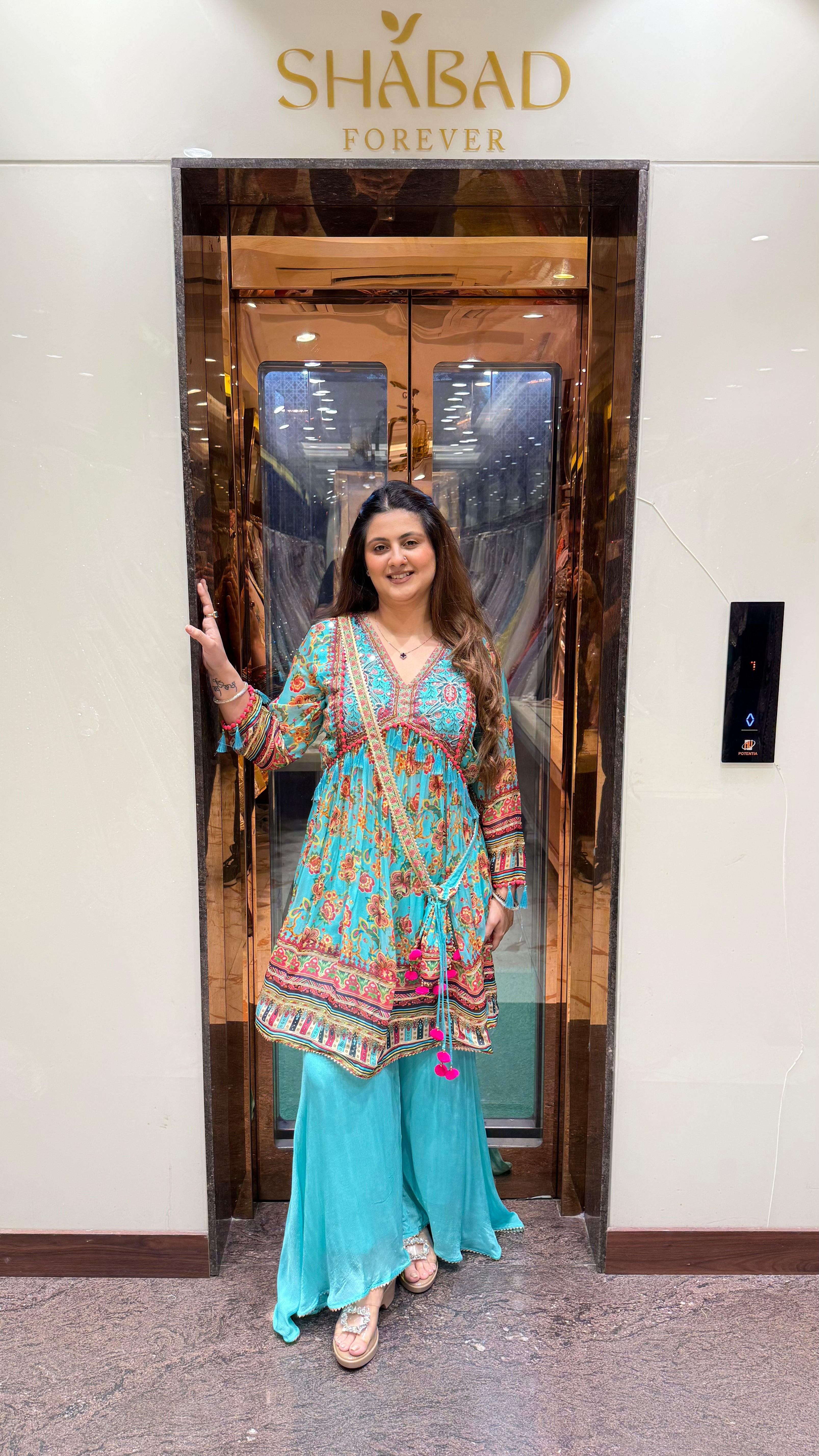 PRINTED PEPLUM KURTA WITH GHARARA & POTLI BAG