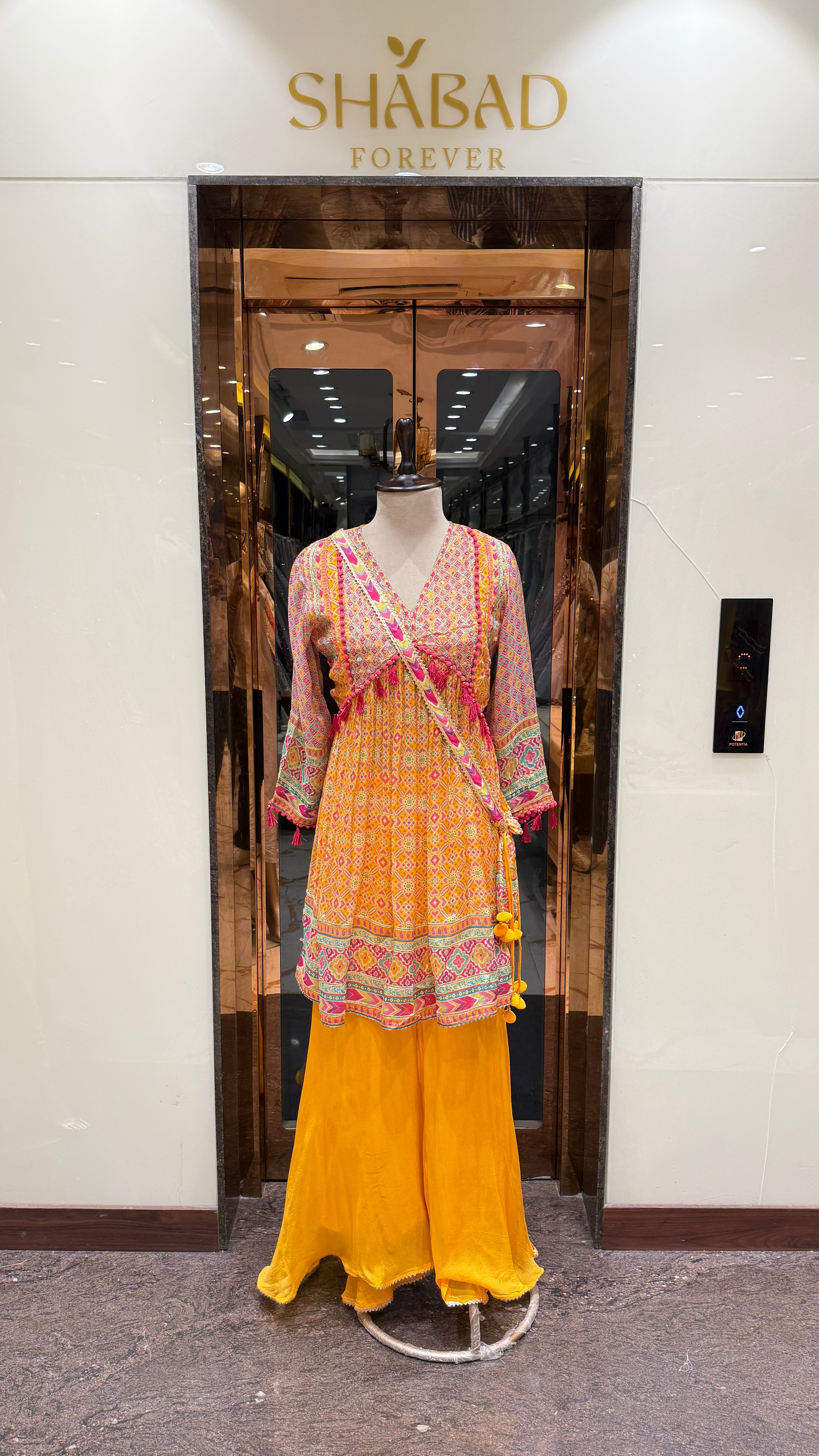 PRINTED PEPLUM KURTA WITH GHARARA & POTLI BAG