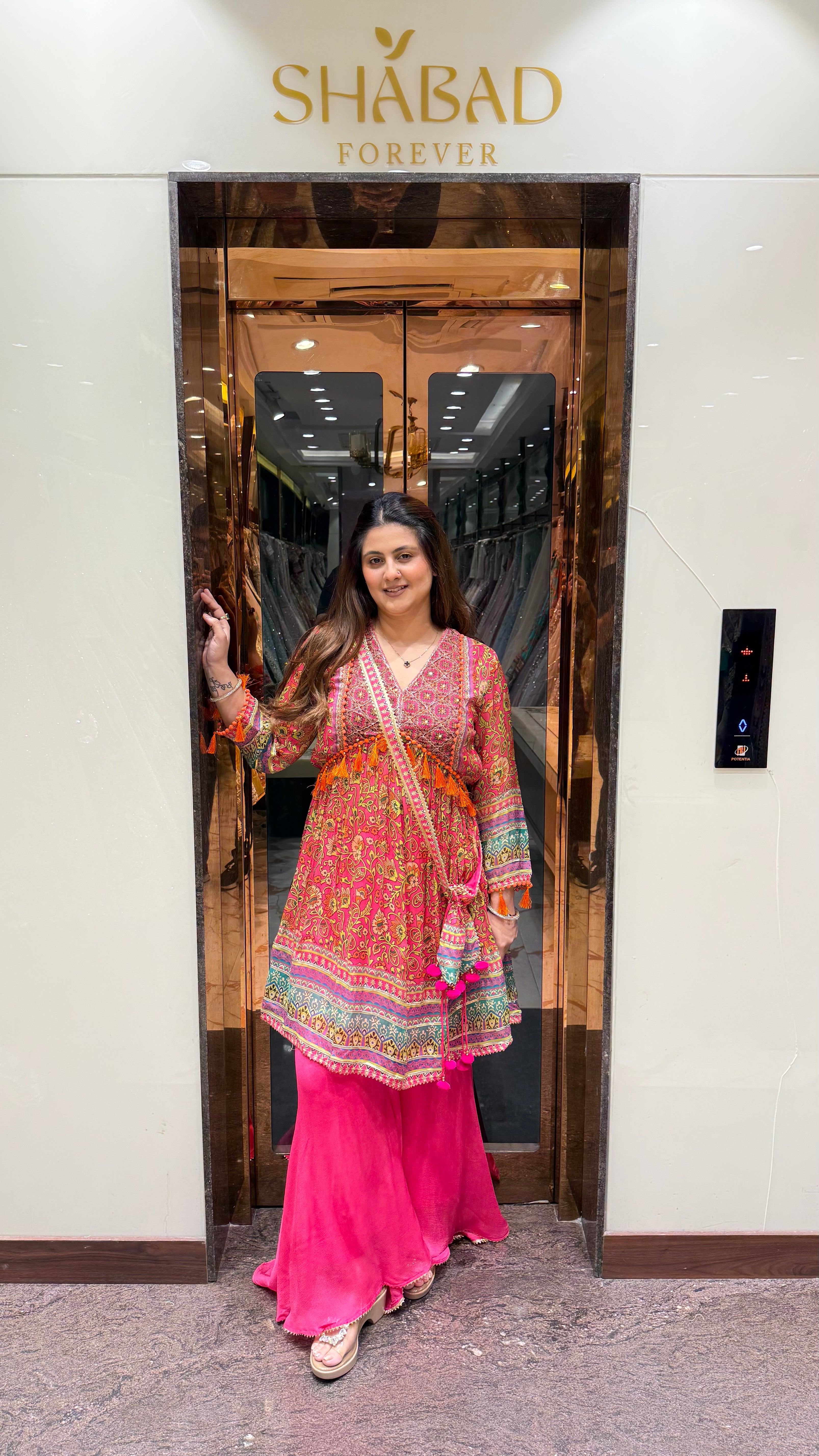 PRINTED PEPLUM KURTA WITH GHARARA & POTLI BAG