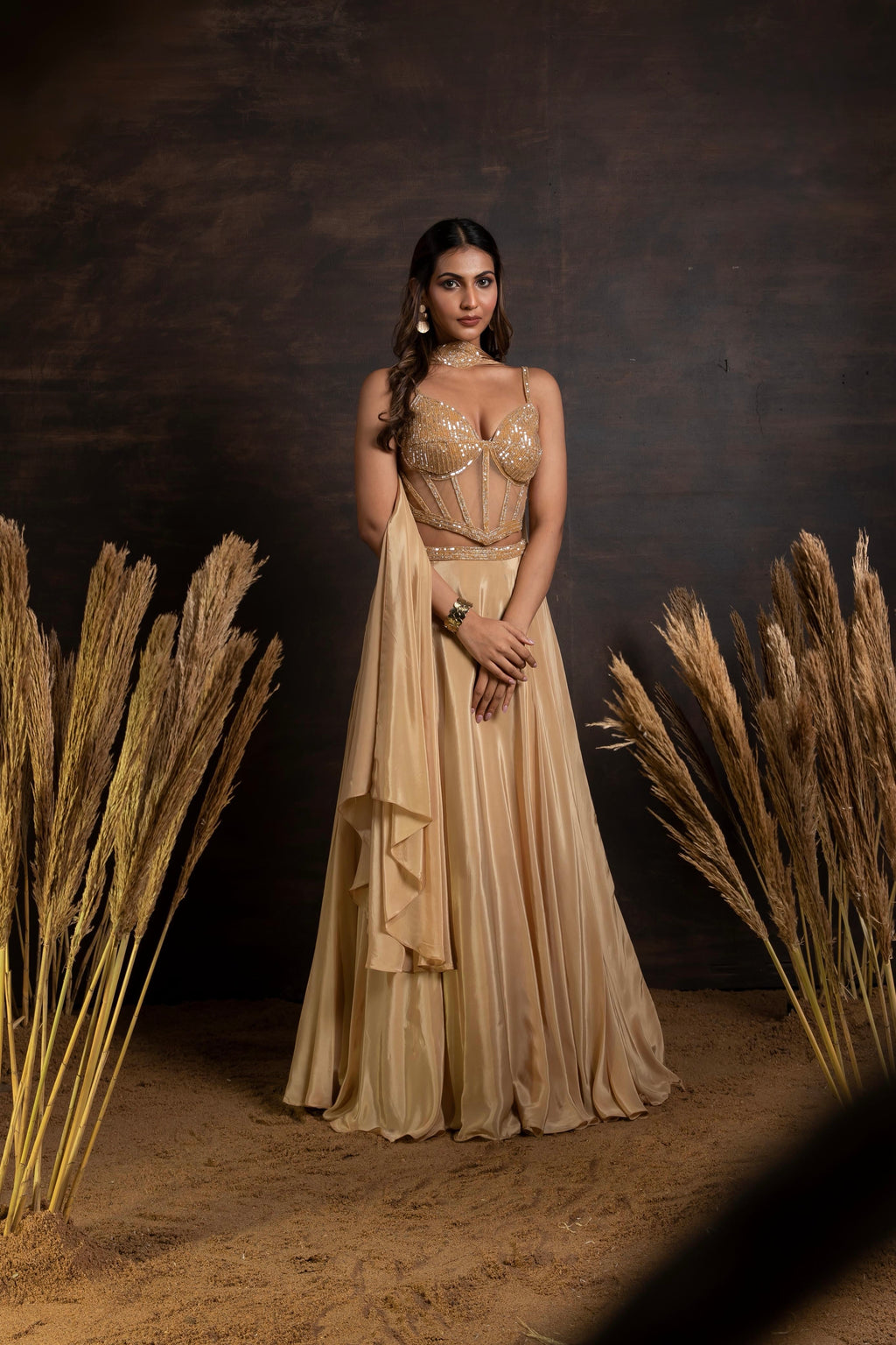 Golden handwork corset with satin crepe lehenga and choker duppatta
