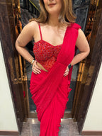 Red stone work corset blouse sequin drape saree