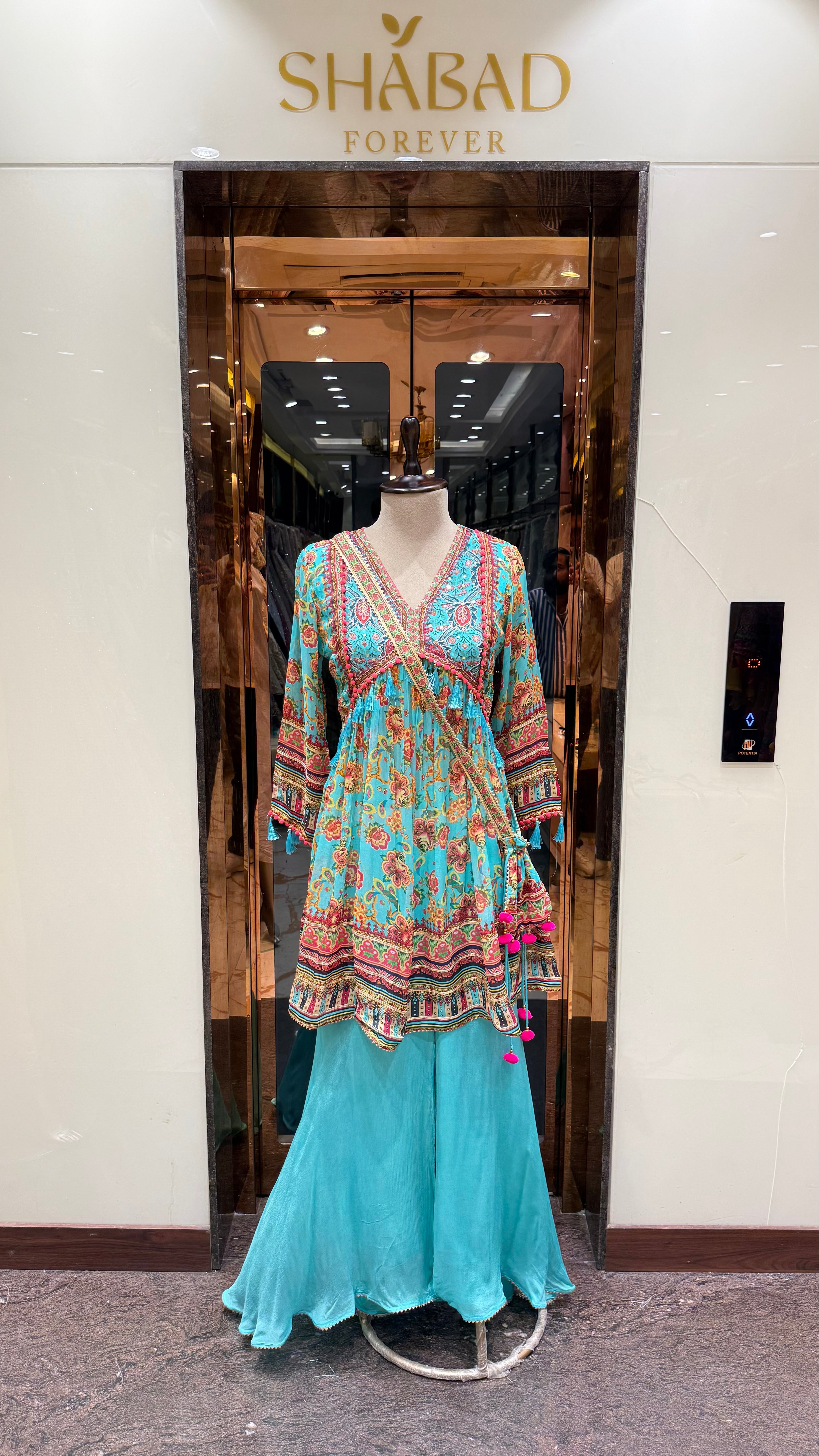 PRINTED PEPLUM KURTA WITH GHARARA & POTLI BAG