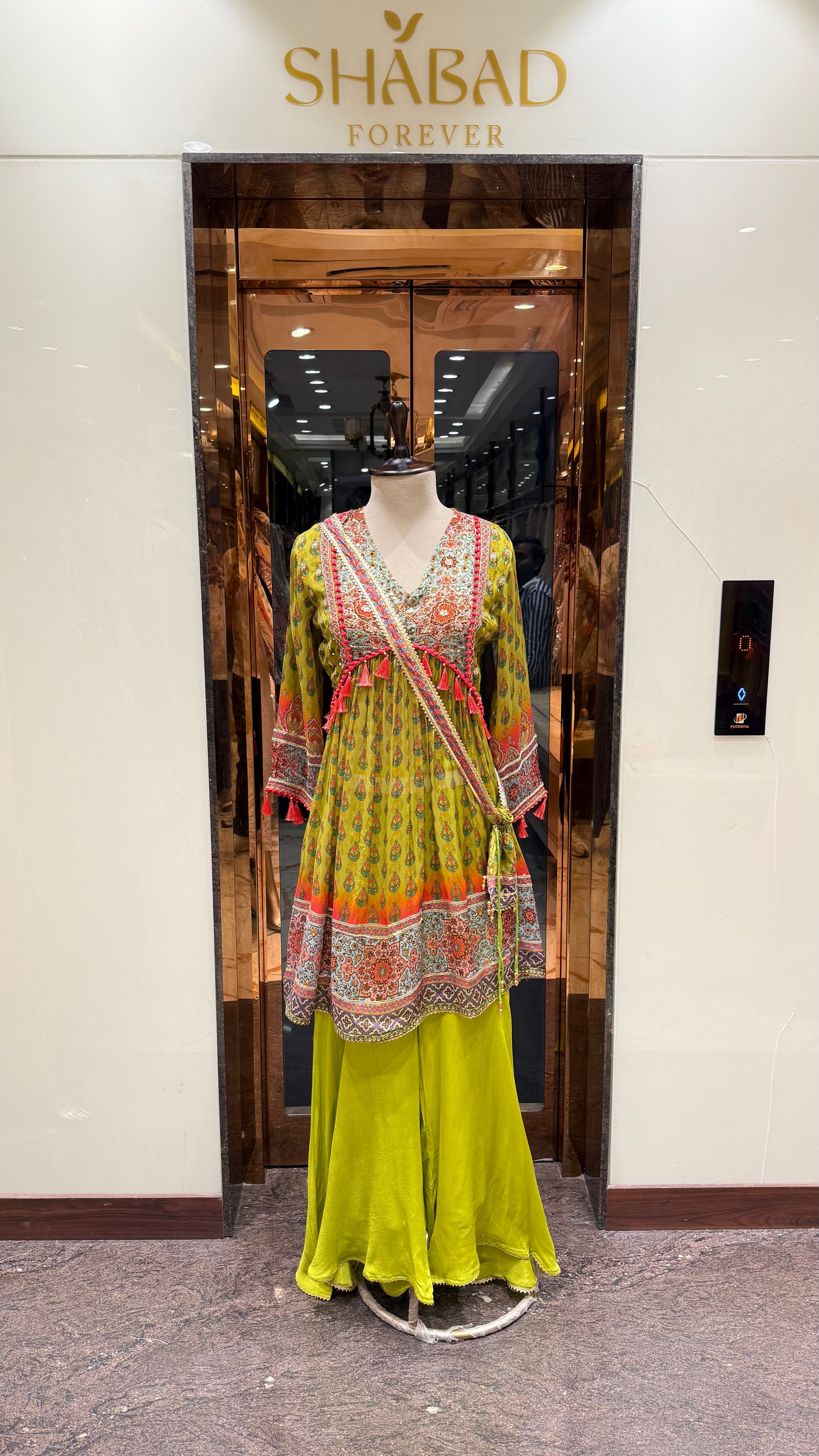 PRINTED PEPLUM KURTA WITH GHARARA & POTLI BAG