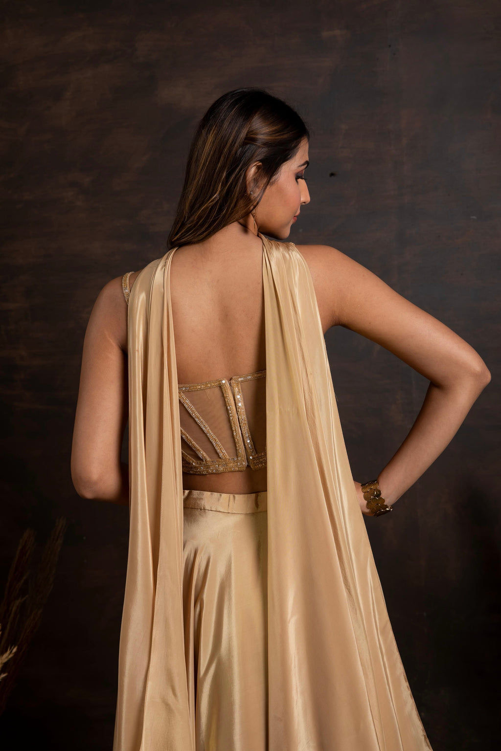 Golden handwork corset with satin crepe lehenga and choker duppatta