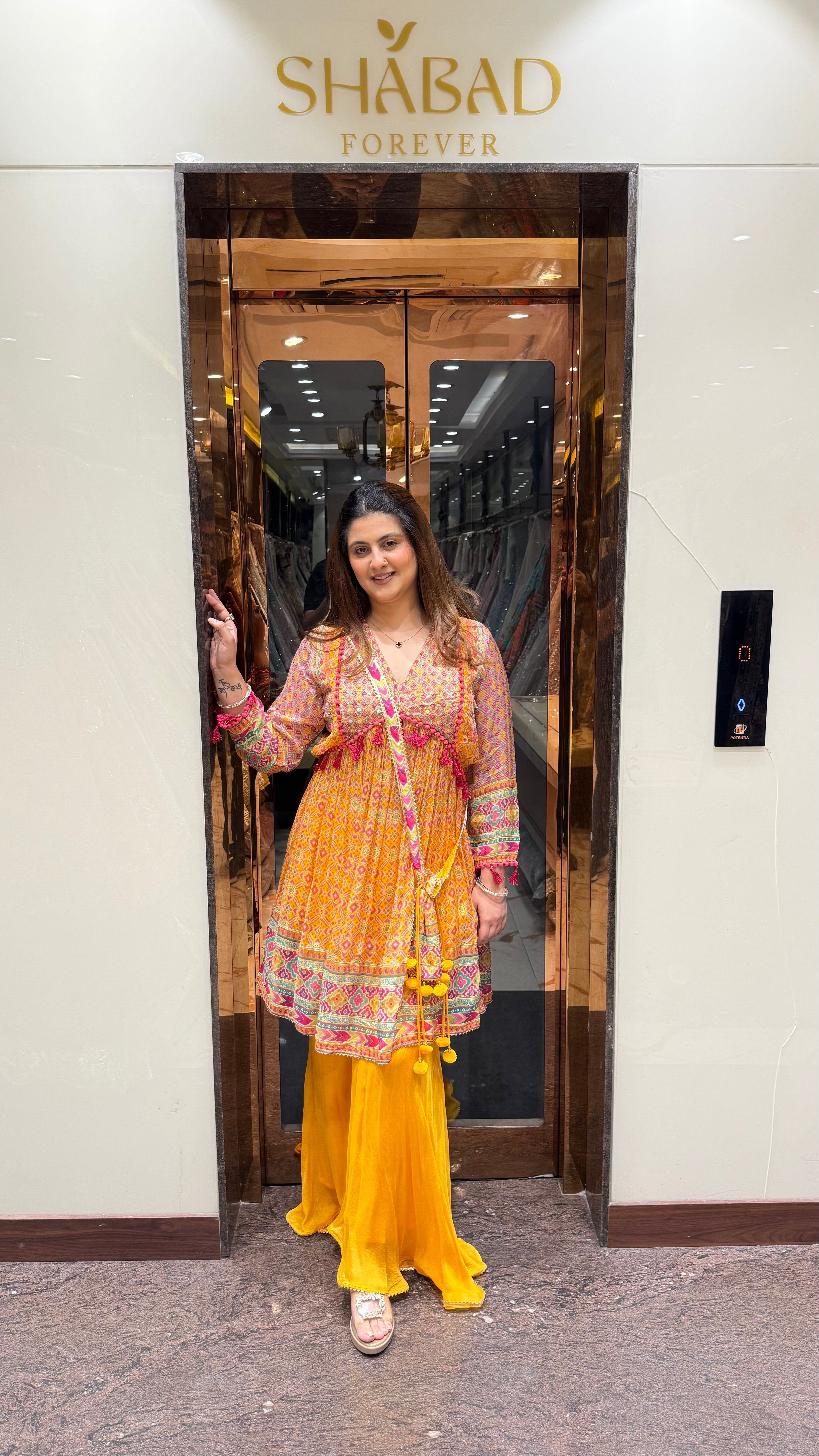 PRINTED PEPLUM KURTA WITH GHARARA & POTLI BAG