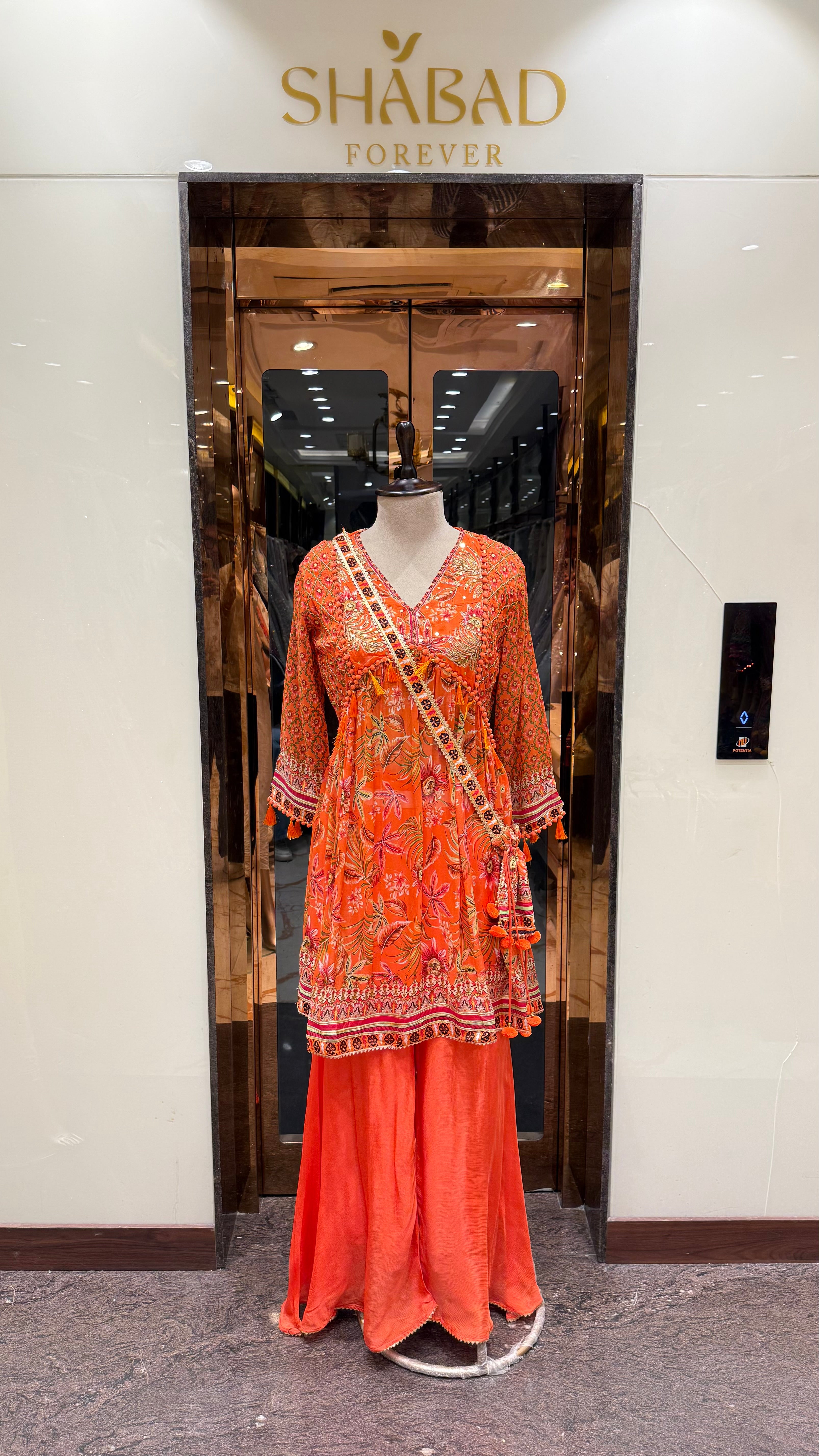 PRINTED PEPLUM KURTA WITH GHARARA & POTLI BAG