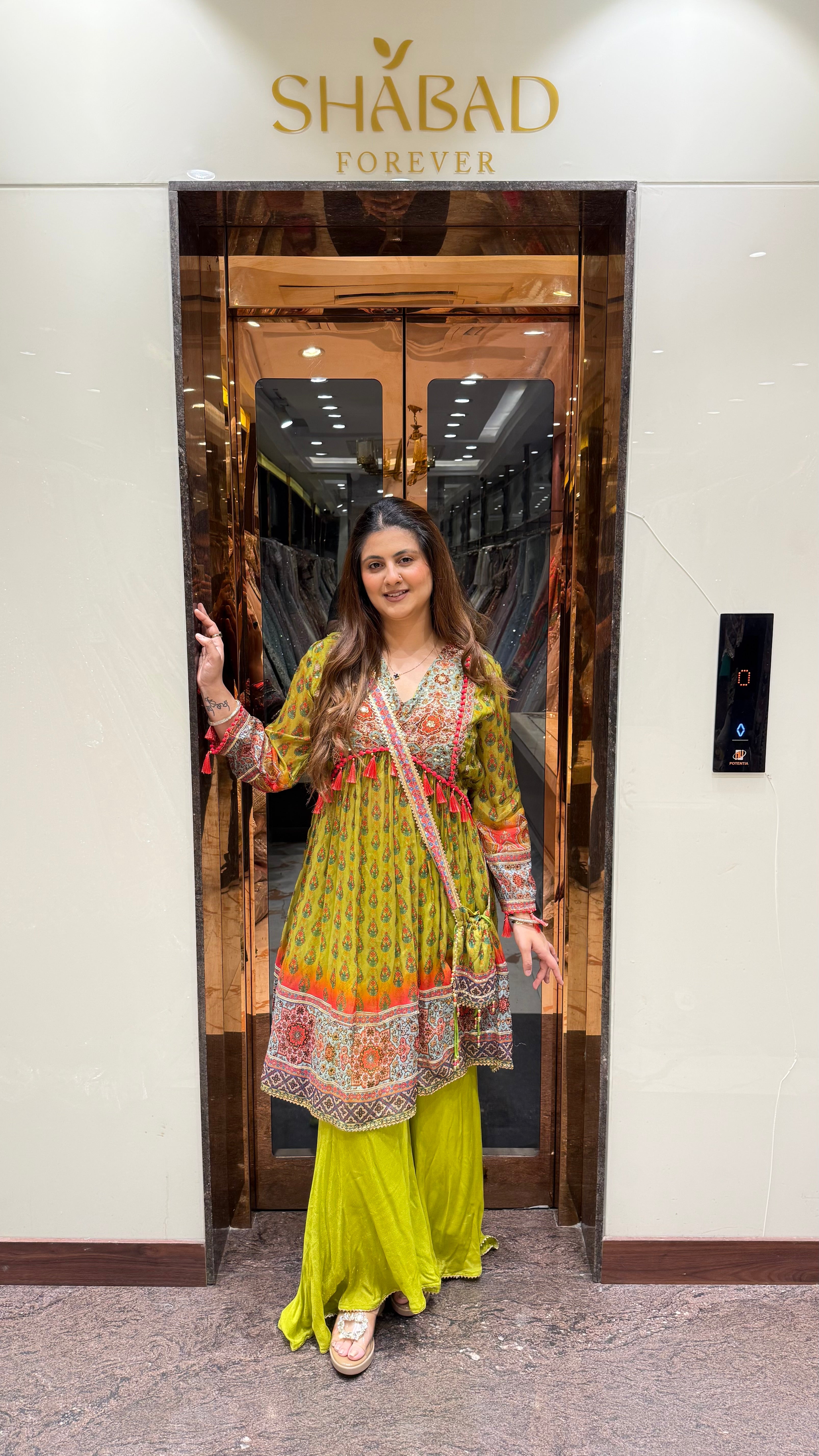 PRINTED PEPLUM KURTA WITH GHARARA & POTLI BAG